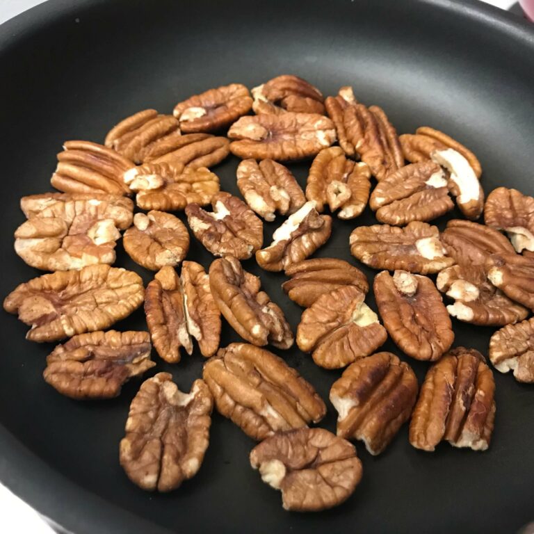 pecans toasting in a skillet