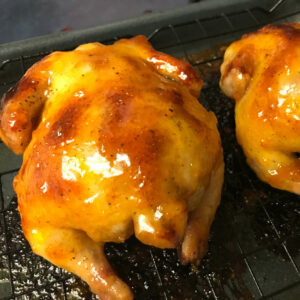 glazed cornish hens on a rack