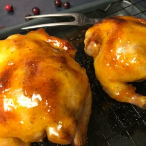 cooked glazed cornish hens on a rack