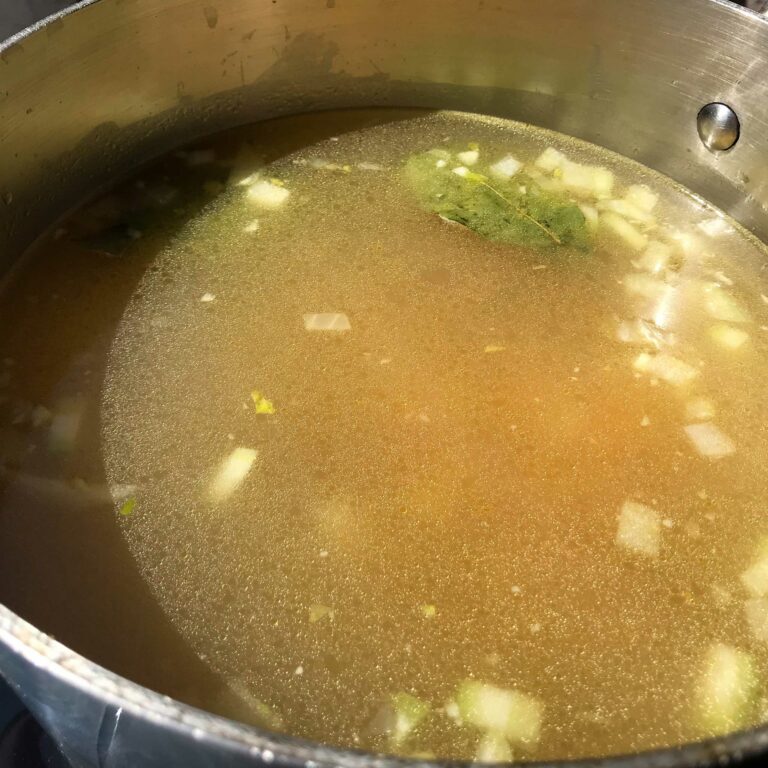 broth and veggies in a pot