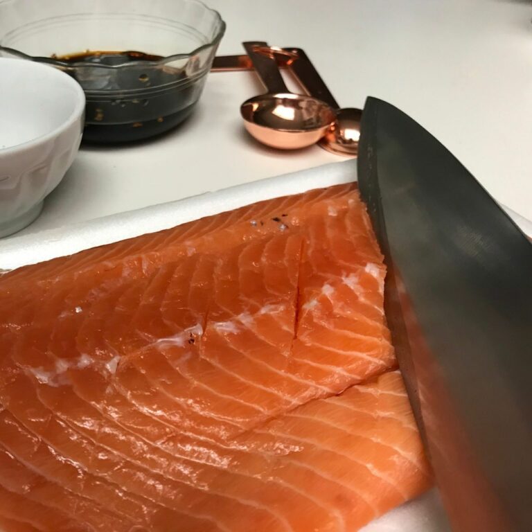 slicing slits into salmon