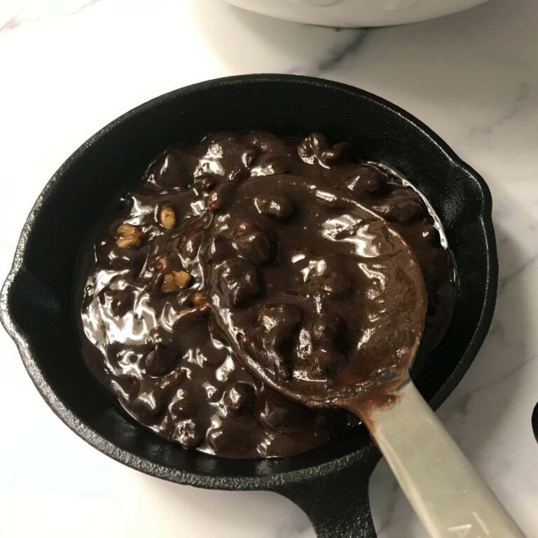 spooning brownie mix into skillet