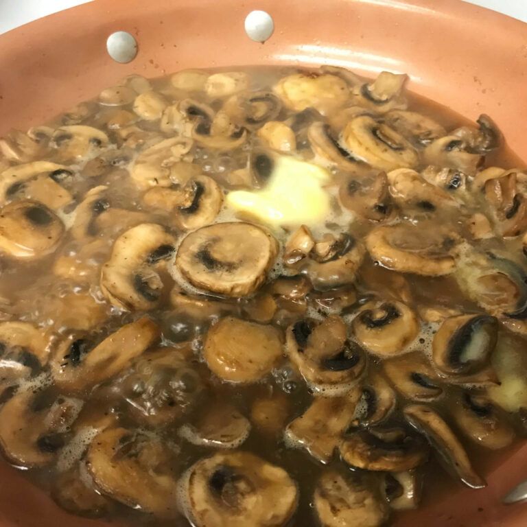 mushrooms cooking in stock and butter