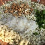 cauliflower rice ingredients in a skillet on the grill