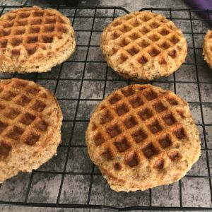 cornmeal chia waffles on a rack.