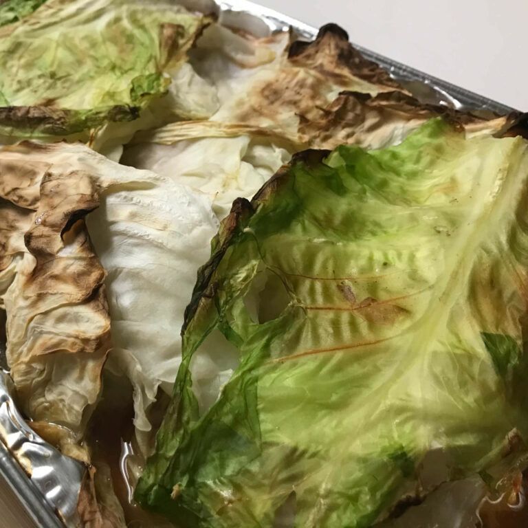 brown cabbage on top of cooked cabbage rolls