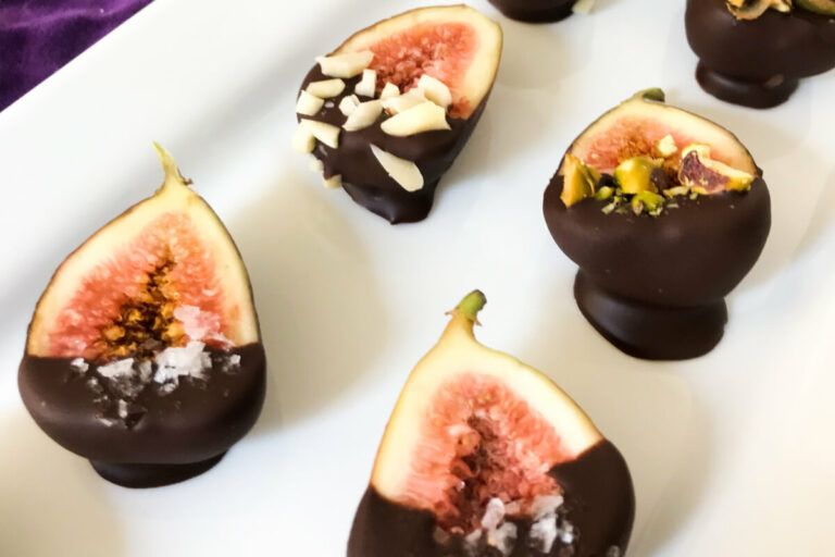 chocolate dipped figs on a platter