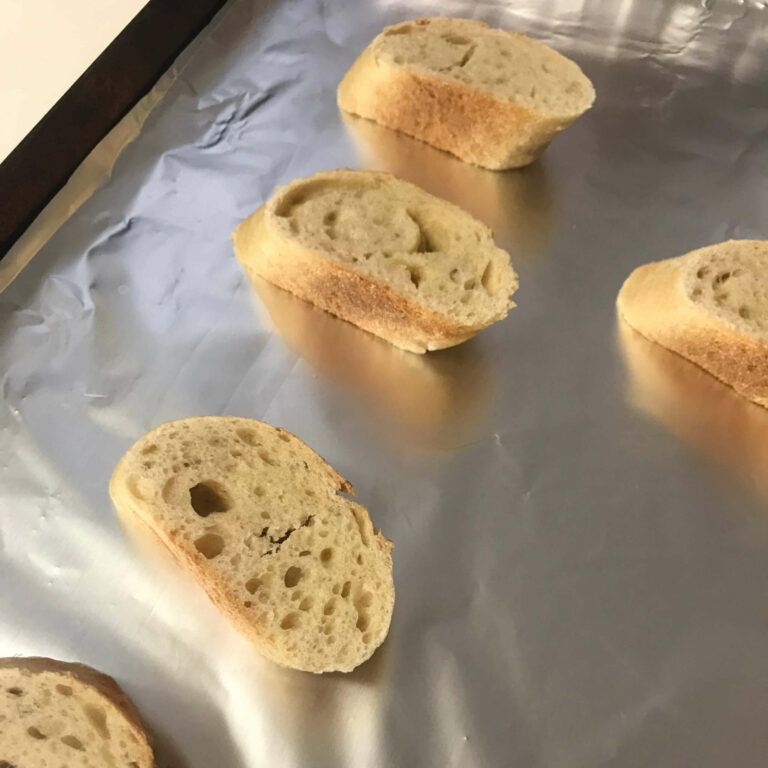 bread slices on a baking sheet