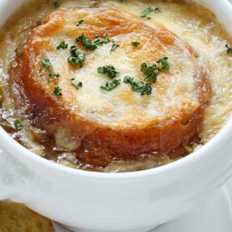 cup of onion soup with cheese toast