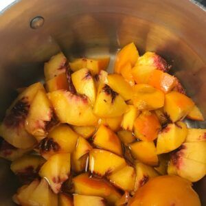 cut up peaches in a pot