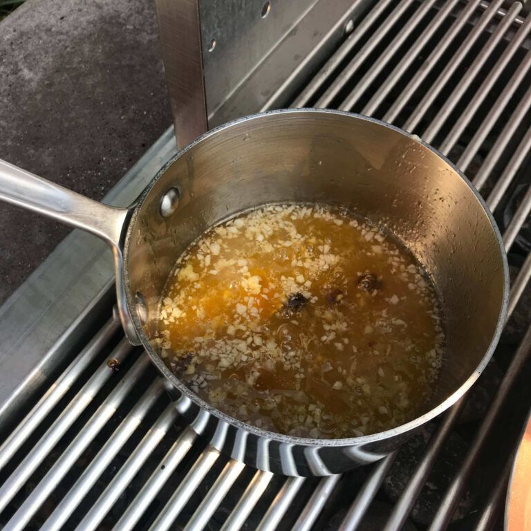 sauce in a pot on grill
