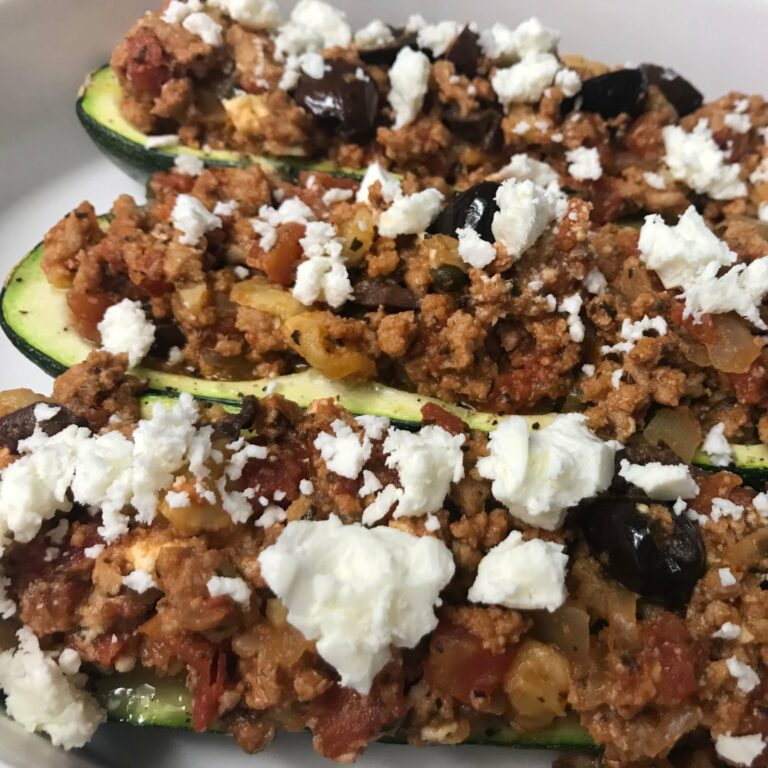 stuffed zucchini topped with cheese
