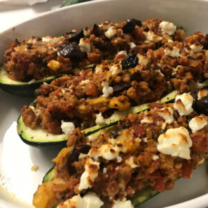 baked Greek turkey zucchini canoes in a dish