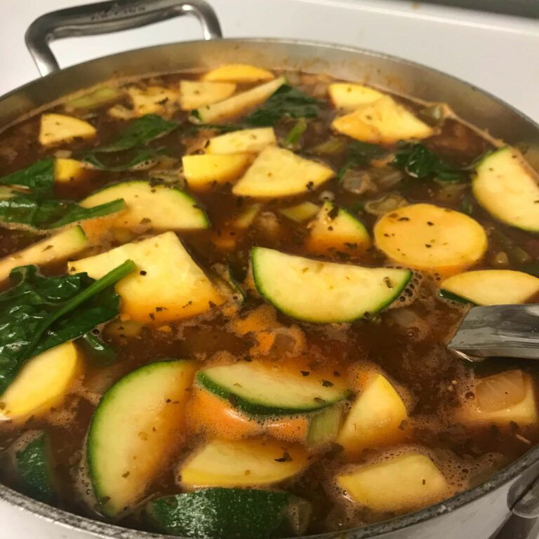 pot of broth with zucchini