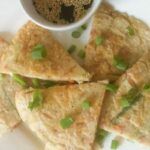 vegetable pancakes and dipping sauce on a plate