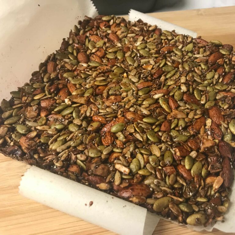 baked nuts and seeds on cutting board