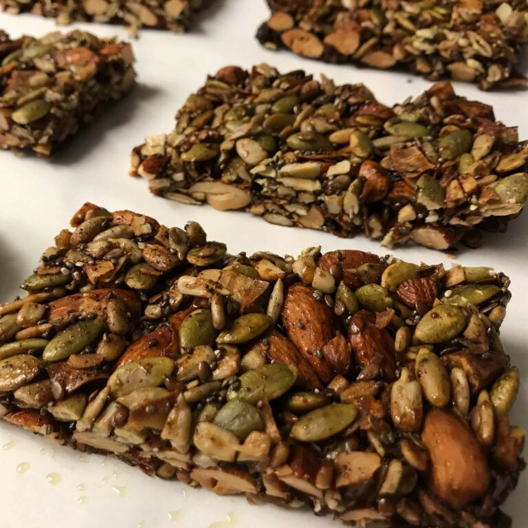 nut and seed bars on parchment paper