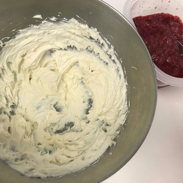bowl of whipped cream cheese and bowl of raspberry puree.