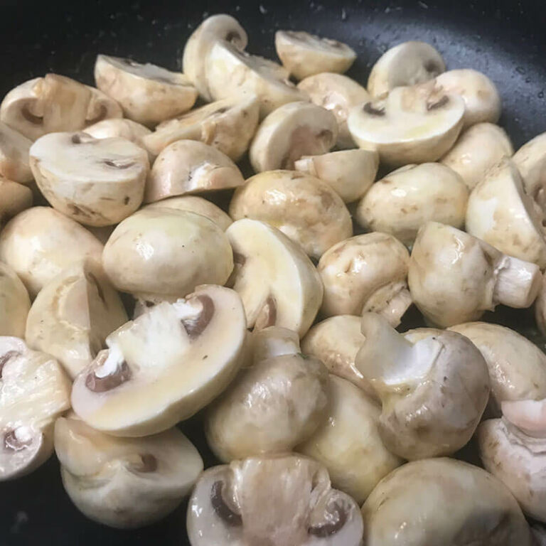 raw mushrooms in a skillet