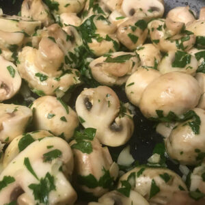 cooking mushrooms in a skillet