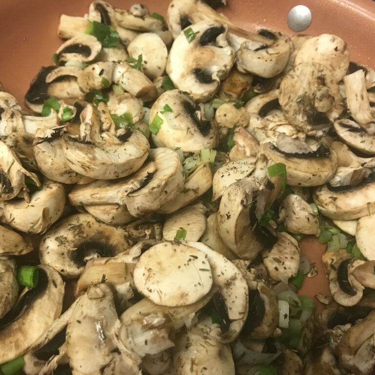 mushrooms cooking in skillet