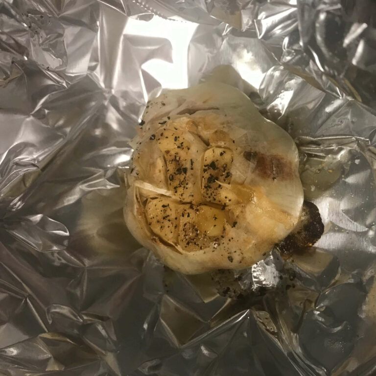 head of garlic in tin foil.