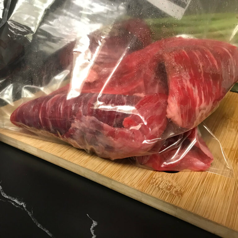 steak in baggie ready for marinade.