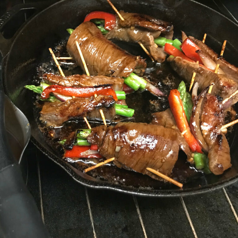 Asian-Beef-Veggie-Rolls in a skillet.