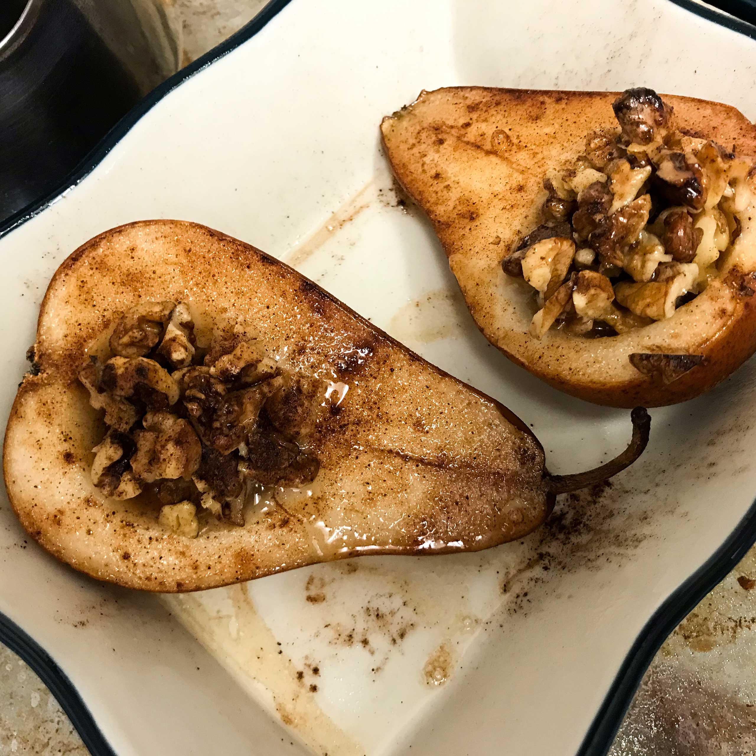 baked pears in a casserole dish.