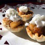 phyllo shells stuffed with pears and topped with whipped cream.