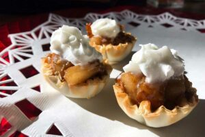 phyllo shells stuffed with pears and topped with whipped cream.