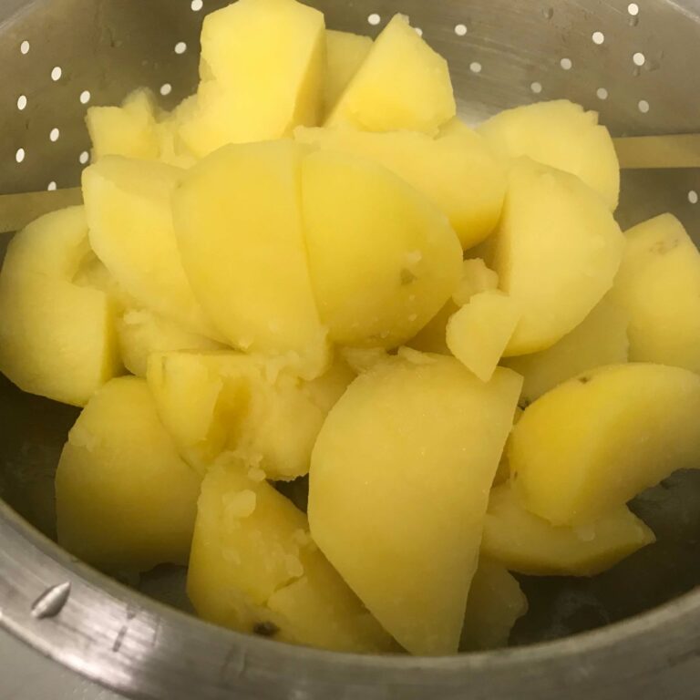 draining potatoes.