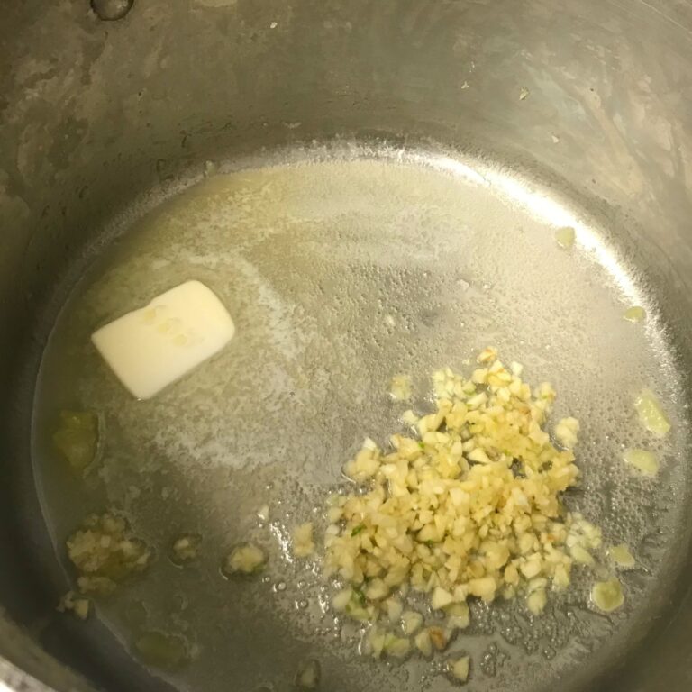 butter and garlic in a pot.