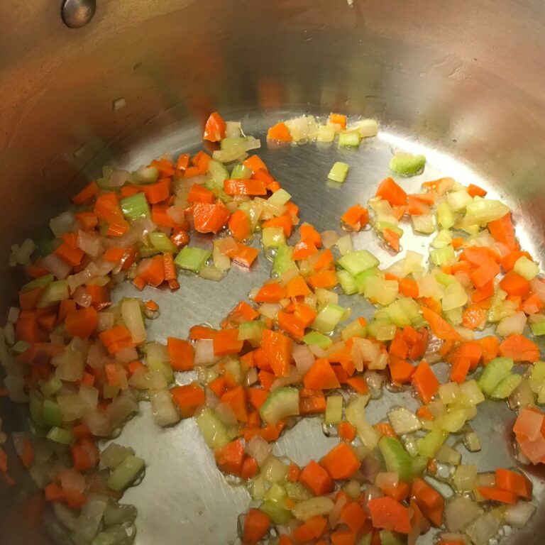 veggies cooking in pot.