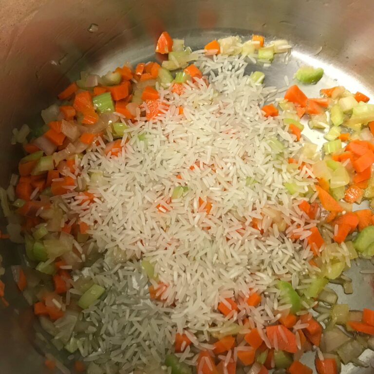 rice added to cooked veggies.