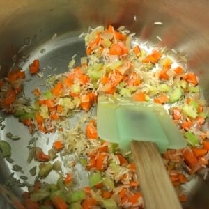 stirring rice and veggies.