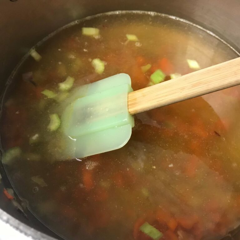 stirring soup.
