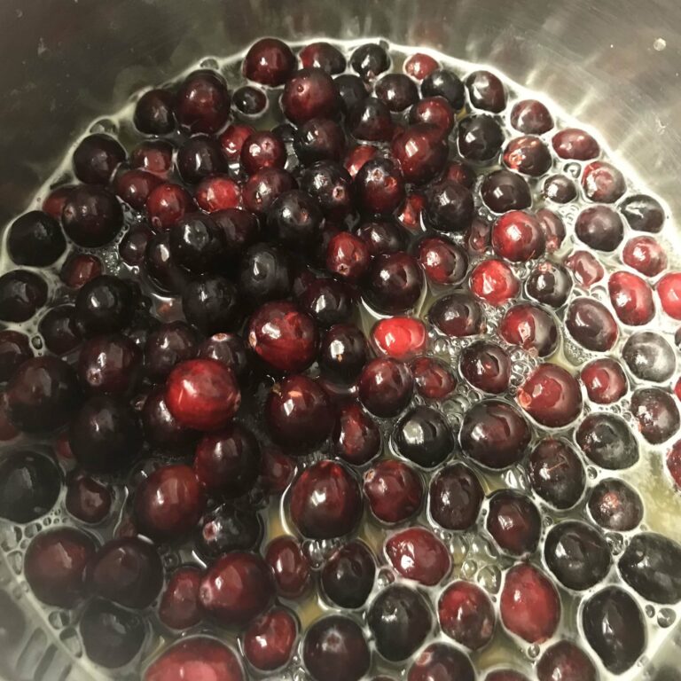 cranberries cooking in a pot.