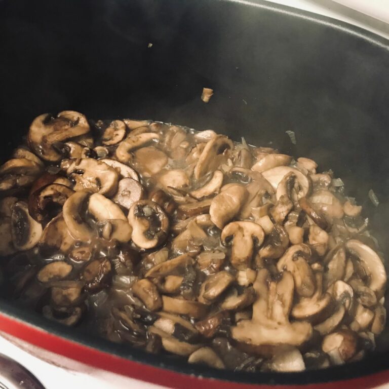 cooking mushrooms in a pot