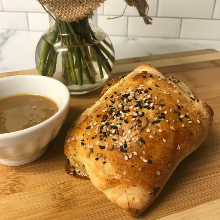 calzone with dipping sauce.