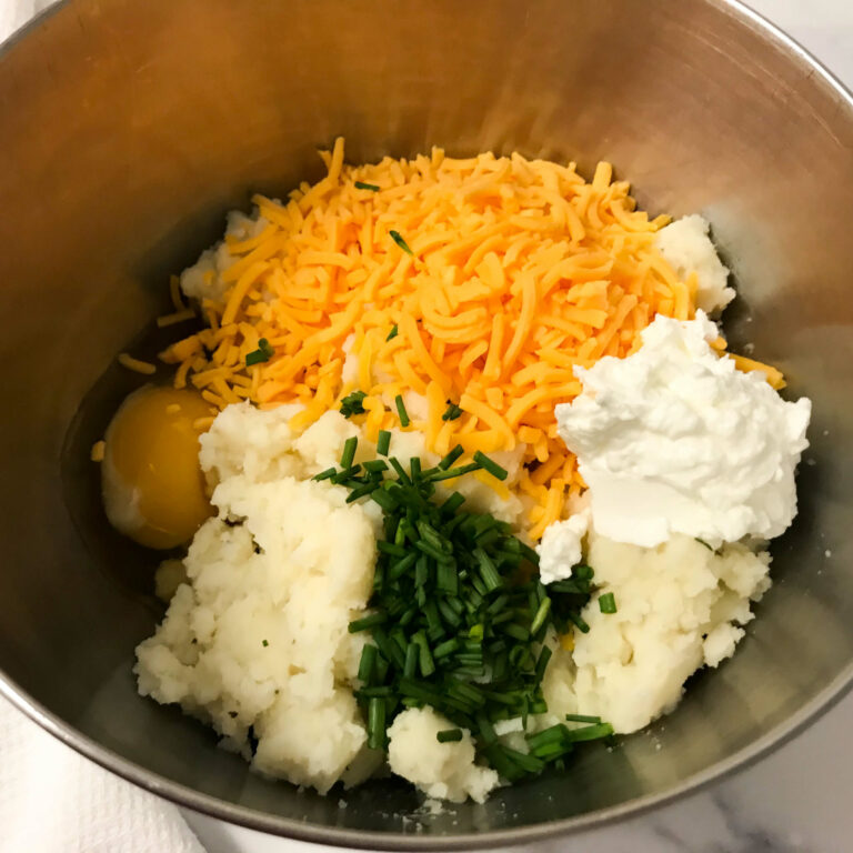 ingredients for potato cakes in a bowl.
