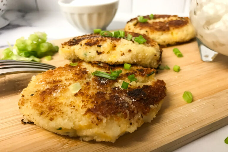 leftover mashed potato cakes on a board.