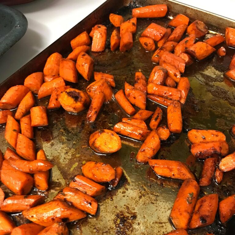 roasted carrots on a baking sheet.