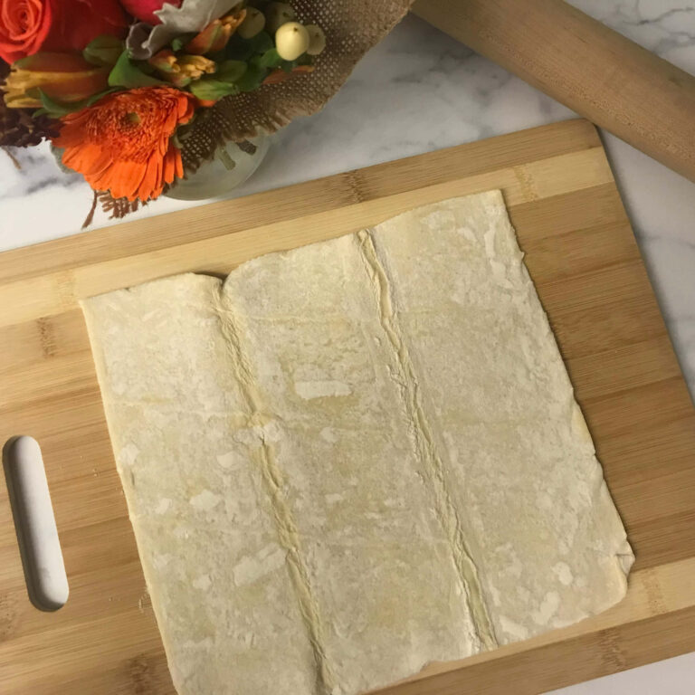 puff pastry on a cutting board.