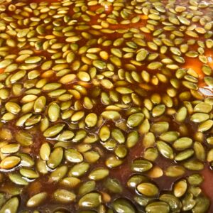 pumpkin seed brittle cooling on baking sheet.