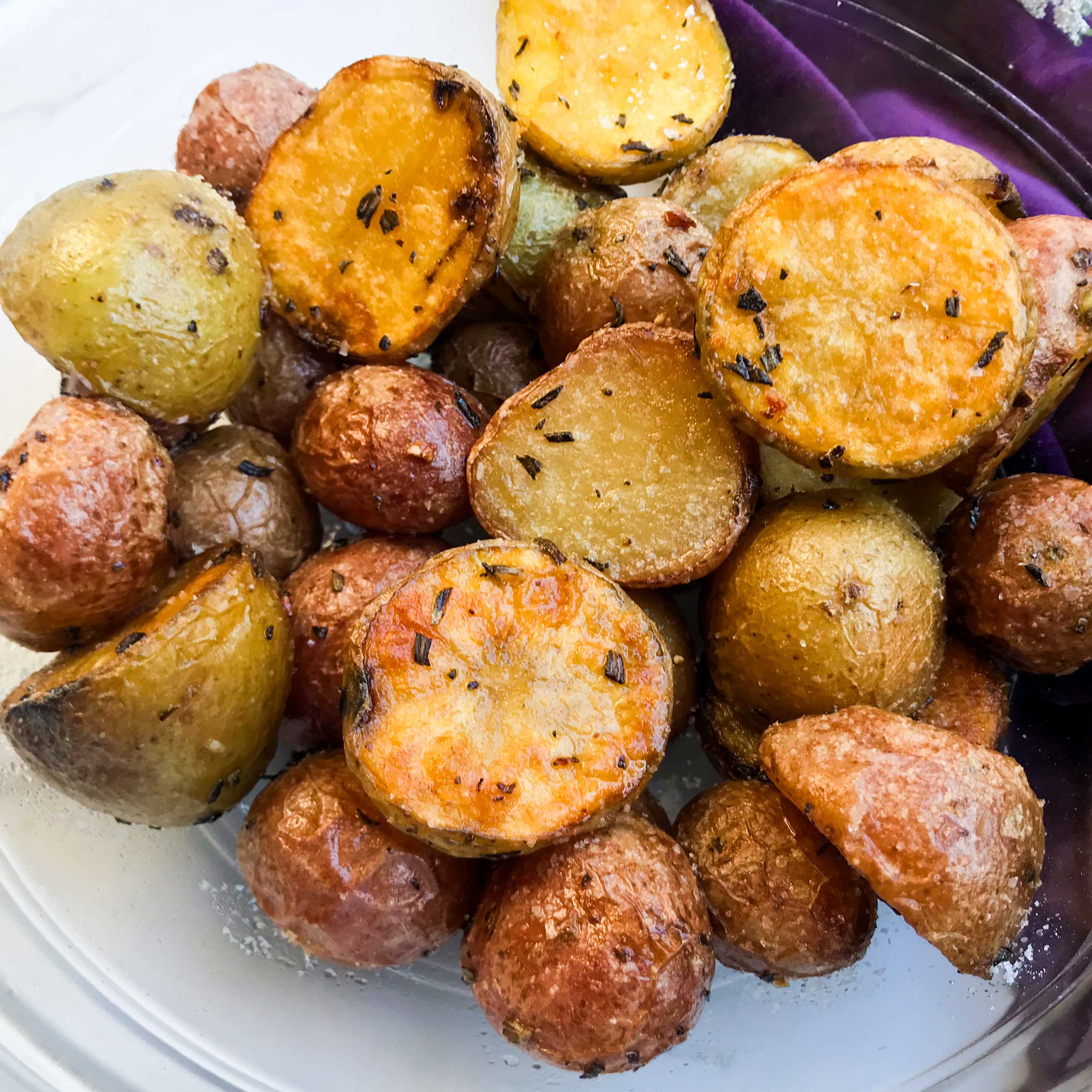 roasted rosemary and garlic baby potatoes in a bowl.