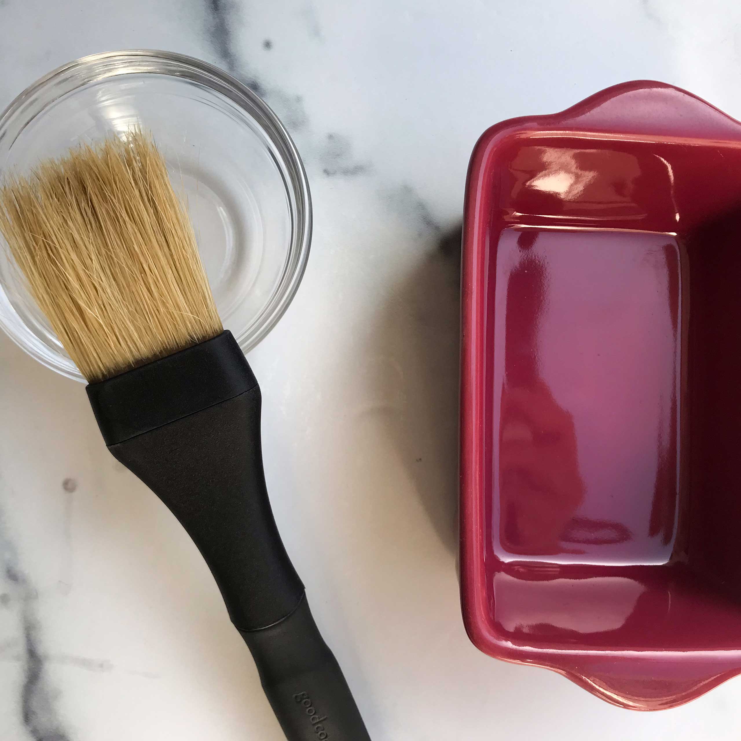 brush, oil and cake pan.