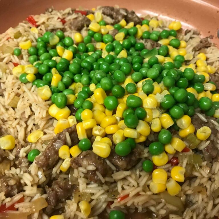 cooked rice with corn and peas.
