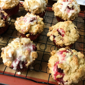 Clementine-Glazed-Cranberry-Walnut-Muffins on a rack.