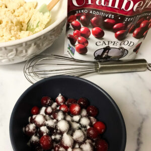 cranberries and sugar in a bowl.